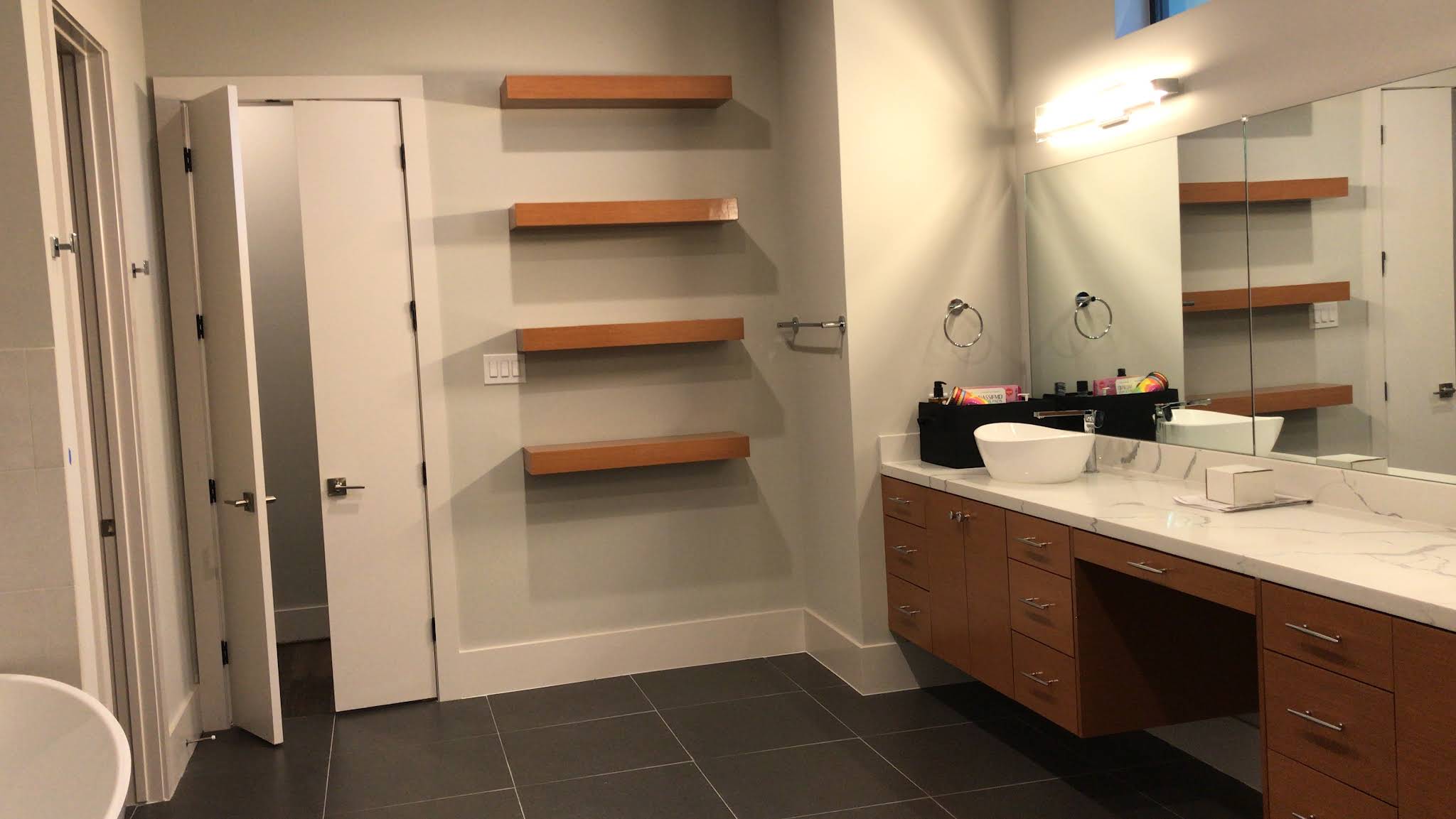 Wood vanity with floating shelves