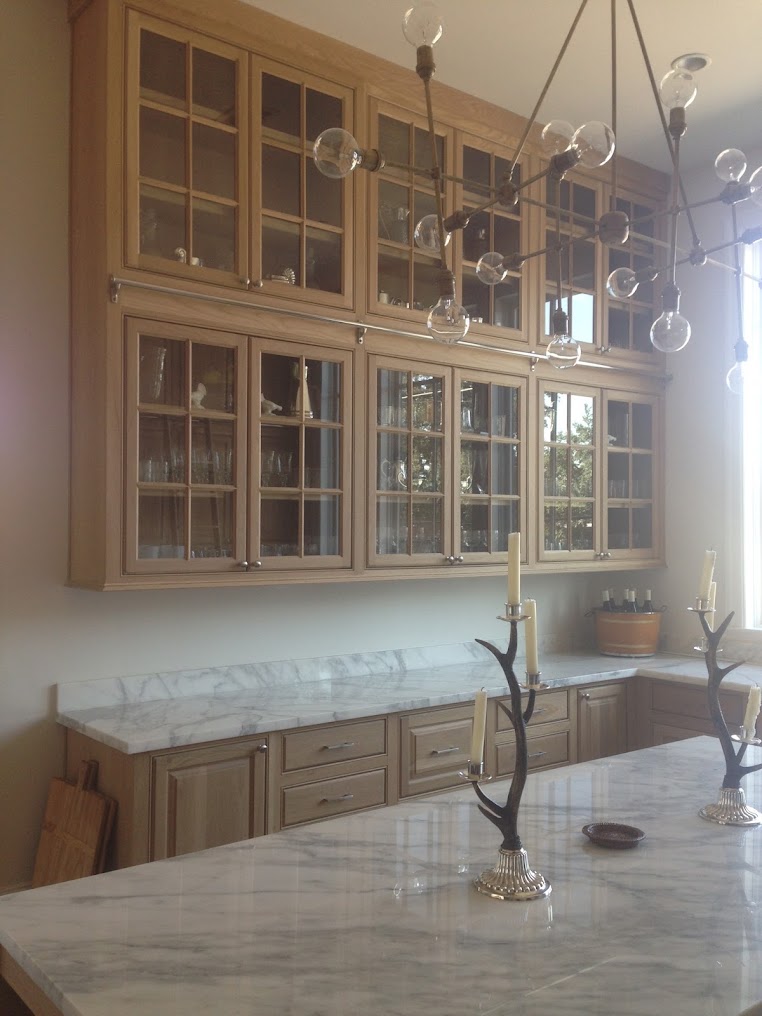 Glass-front cabinets in a wood kitchen