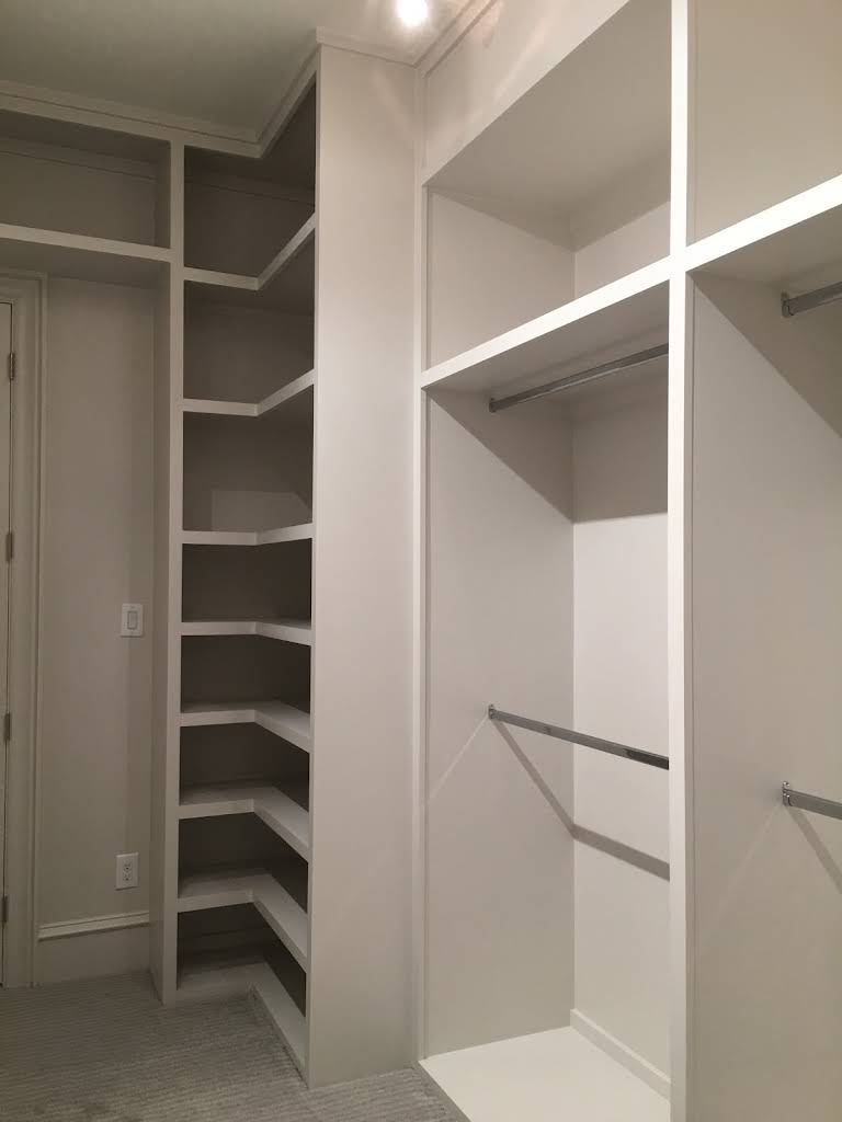 Hanging space and shelves in a white closet