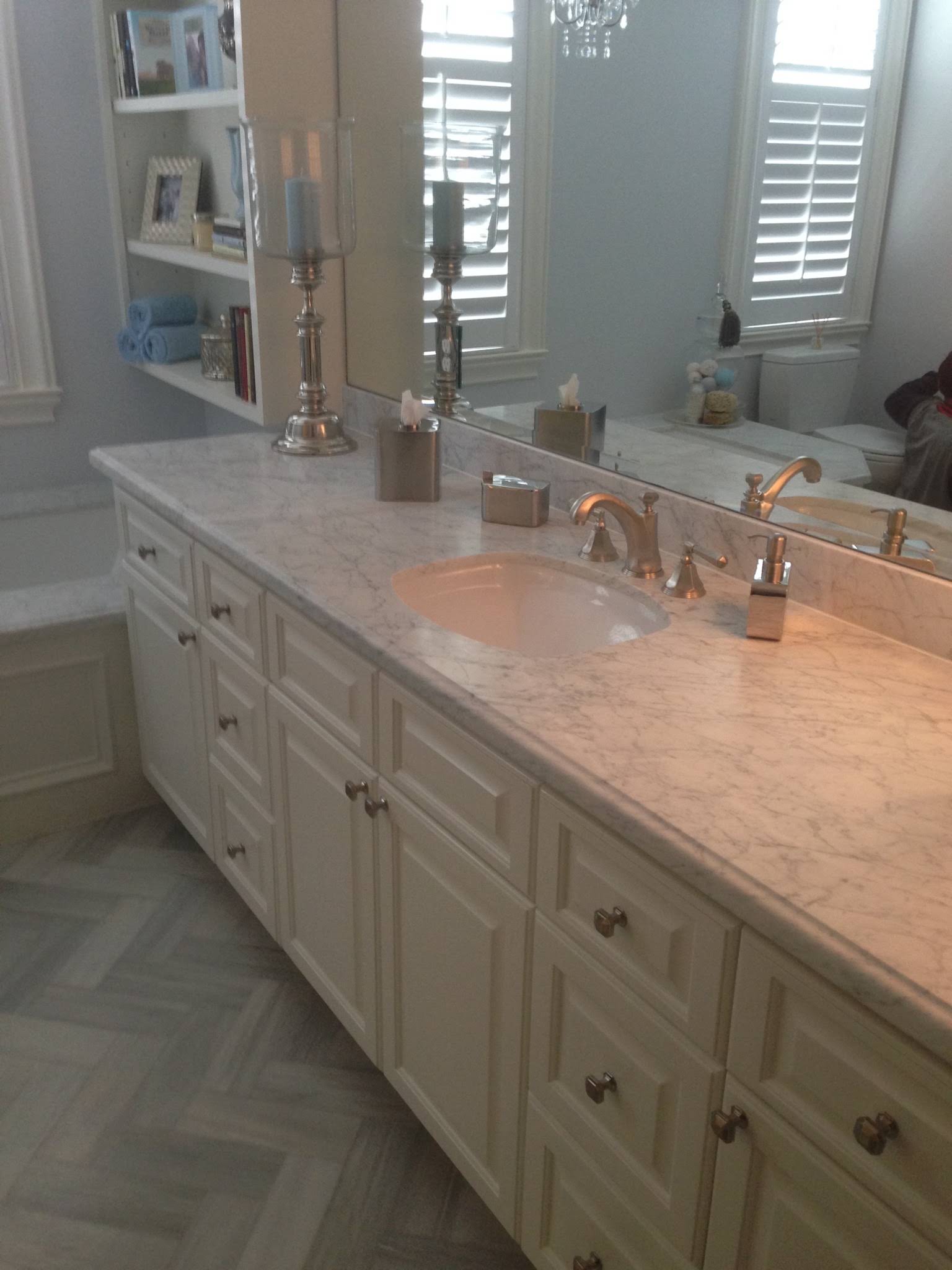Long white vanity with a light surface