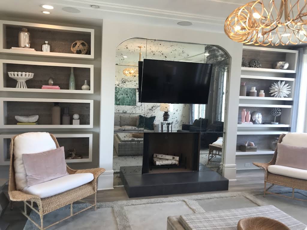 Living room with two bookcases and a fireplace