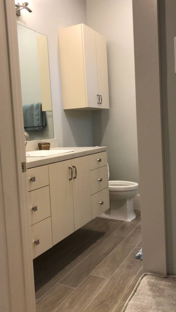 Compact bathroom cabinet and upper storage